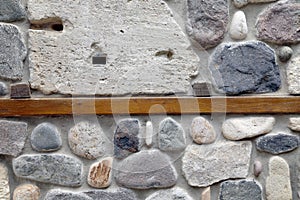 Wall of rocks and stones in cement.