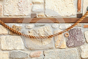 Wall of rocks and stones in cement.