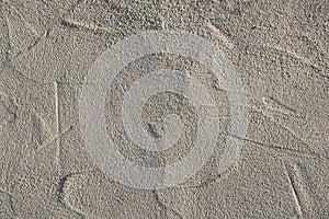 a wall with rough plaster in sunlight