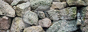 Wall of rough stones background