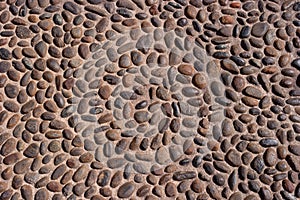 Wall round stone rock texture and seamless background.