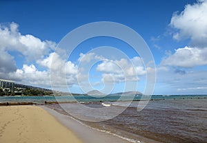 Wall runs into the water at Kahala Beach photo