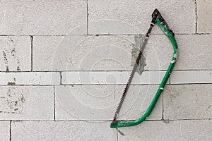 Wall with saw hanging