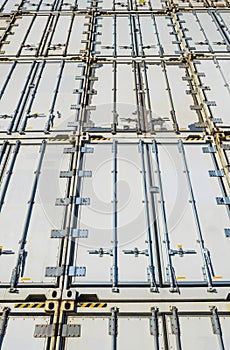 Wall of shipping containers stacked high