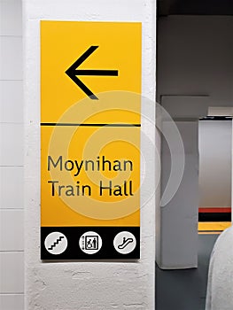 Wall sign \'Moynihan Train Hall\' on white concrete wall
