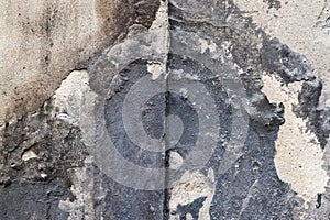 Wall in a steel mill with clear signs of use, cracks and pipes. High resolution background