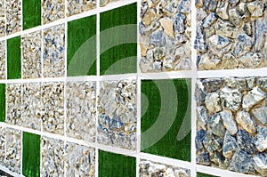 Wall of stone and artificial grass background
