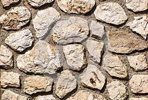 Wall from stones with an irregular row