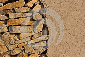 Wall of stones and loam photo