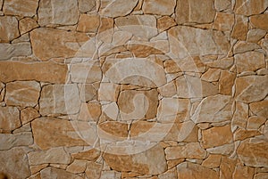 Wall of stones, stone wall, marble, granite texture of gray color on a summer day