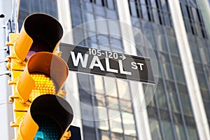 Wall Street Sign and yellow traffic light, New York