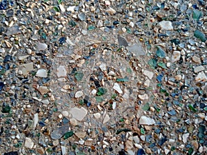 Wall with the surface full of broken glass pieces texture