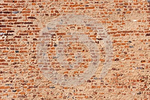 Wall texture with ancient exposed red bricks