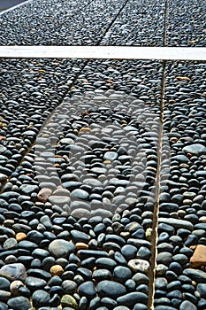 Wall texture decorated with blue pebbles, pebbles glued to the wall