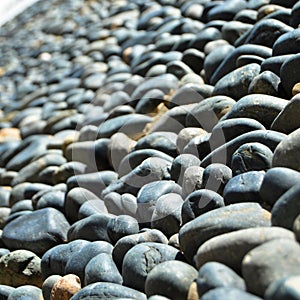 Wall texture decorated with blue pebbles, pebbles glued to the wall