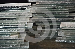 Wall texture of frosted glass heap on wooden floor