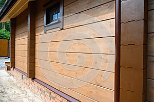 Wall texture of new wooden house painted with natural brown oil color.