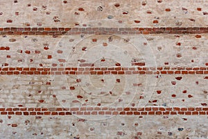 Wall texture with plaster and exposed red old brick
