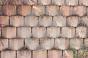 wall texture with red and orange bricks in geometric shape