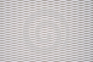 Wall texture with white rounded recesses in even rows. Futuristic background