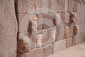 Wall in Tiahuanaco with stone faces