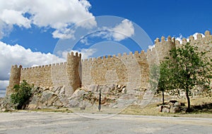 Wall, tower and bastion of Avila, Spain, made of yellow stone bricks