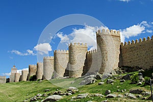 Wall, tower and bastion of Avila, Spain, made of yellow stone bricks