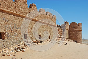 Wall and tower of castle at Abu Nujaym in Libya