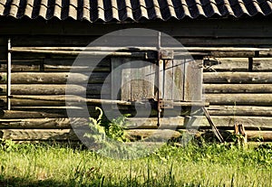 The wall of traditional wooden old village log house