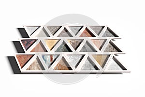 Wall with triangles of different materials in white frames