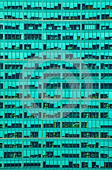 Wall of turquoise glass of New York City skyscraper office building