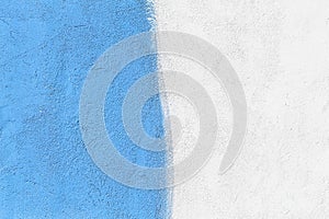 Wall two tone colors: blue and white paint on concrete surface design abstract texture background blank empty