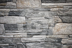 Wall of uneven rocky stones in a house