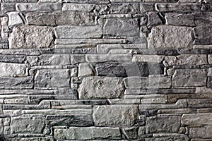 Wall of uneven rocky stones in a house