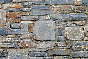 wall of uneven rocky stones on the houses of the pelion mountain