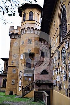 Wall of villa Stibbert overlooking the park. In the image you can see, a staircase the section of wall covered with coats of arms,