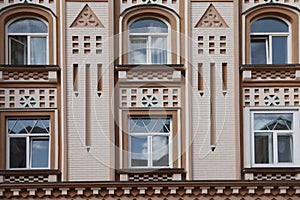 Wall of vintage building with windows