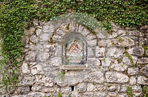 Wall wayside shrine to saint Wolfgang, St.Gilgen, Austria