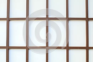 Wall of white wood grid panels. Wall decorative interior background.