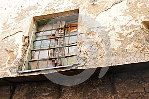 Wall and window with bars.