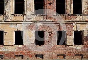 Wall with windows of old brick building before renovation