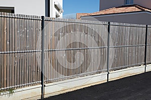 wall wooden and steel fence street wood barrier modern house protect view home garden