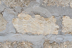 Wall of yellow shell rock blocks, natural stone, textural background, close-up