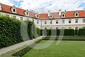 The Wallenstein Palace stands near the Vltava River in the northern part of the Lesser Country. Alleys of the garden are decorated