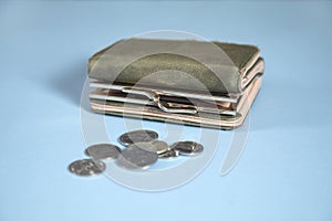 Wallet with coins on table