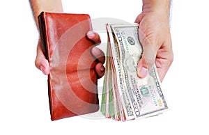 Wallet and dollar money showing in men`s hand isolated on