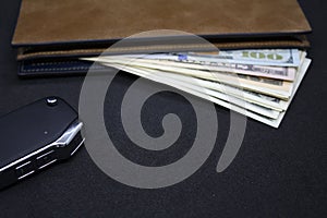 Wallet with dollars on a dark background