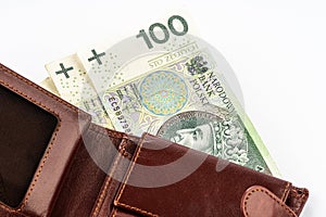 Wallet with polish 100 zloty banknotes. Polish currency. Money spending concept on white background