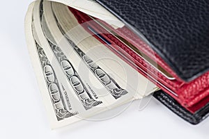 Wallet with 100 U.S. dollars bills. Close-up.