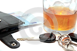 Wallet whiskey car keys and euro cash